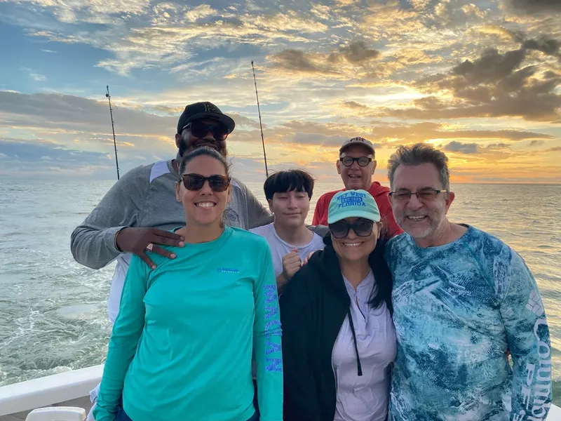 Six of us on the boat at sunset in Boca Grande