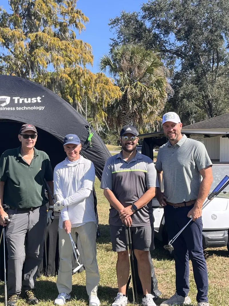 Four of our golfers under the Protected Trust tent