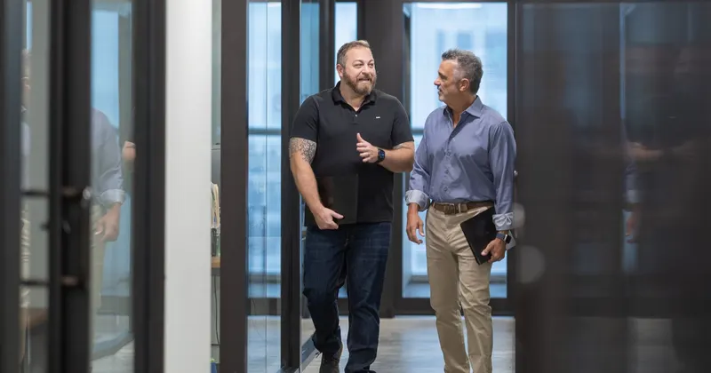 Three of the team at the corridor door