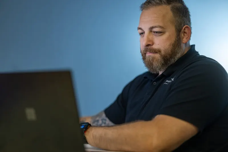 Stephen at the desk in Winter Haven, after dark