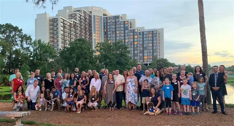 The whole company and the families on the lawn at the Hyatt Regency Grand Cypress